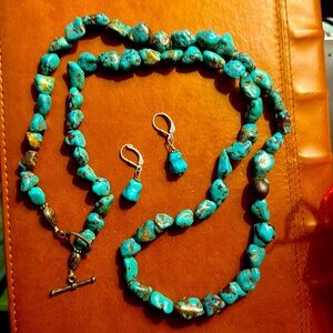 One of a kind Navajo turquoise necklace and matching earrings.